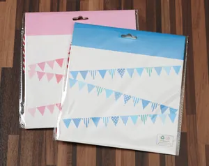 Detail of pink and blue paper pennant banners with geometric patterns in packaging