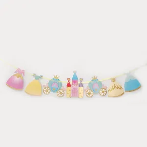 Detail of princess castle party banner with glitter pumpkin carriages and colorful dresses