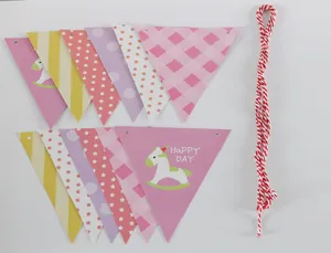 Detail of cartoon rocking horse pennant banner with assorted patterns and cotton string