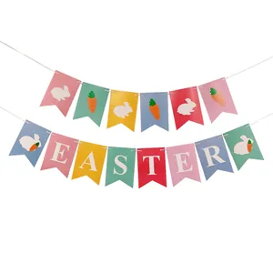 Close-up of colorful Happy Easter banner flags with bunny and carrot prints for party decor