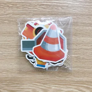 Construction vehicle cake topper set with cartoon traffic cones and yellow trucks