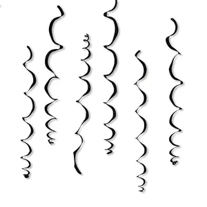 Close-up of black PVC spiral hanging swirls for party decorations on a white background