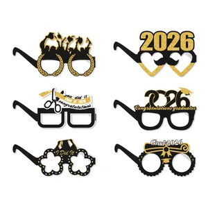 Detailed set of 6 black and gold 2026 graduation party paper glasses with glitter finish