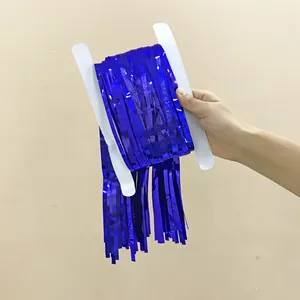 Macro shot of sapphire blue metallic foil fringe curtain wrapped on white paper cardboard