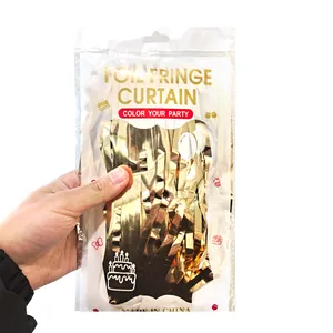 Macro detail of packaged golden foil fringe curtain for party wall decoration
