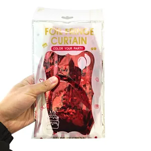 Detail of red foil fringe curtain packaging for party and holiday event decorations