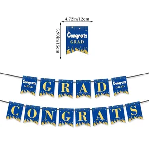 Detail of blue and gold graduation banner showing dimensions 12cm x 15cm for party decor