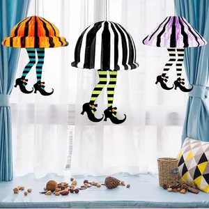 Three Halloween honeycomb witch legs hanging decorations for festive party room decor