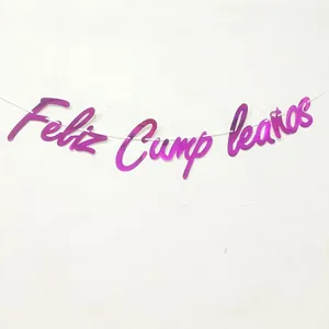 Detail of purple mirror Feliz Cumpleaños birthday banner on a minimalist white wall
