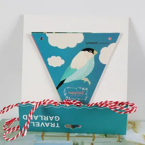 Detailed close-up of travel themed paper bunting flags with cotton twine for party decor
