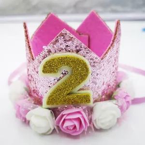 Detail of pink glitter 2nd birthday crown with gold number and foam rose decorations