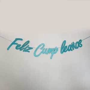 Close-up of glittery blue Feliz Cumpleaños banner with elegant cursive lettering