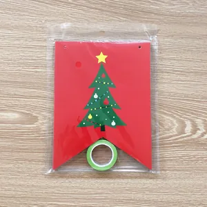 Christmas decoration red triangle flag banner with green tree design and ribbon