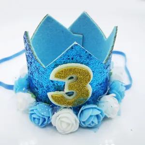 Detailed close-up of blue glitter 3rd birthday crown with foam roses and lace trim