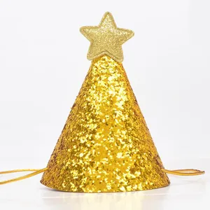 Close-up of golden glitter birthday party hat with a sparkling star topper on white background