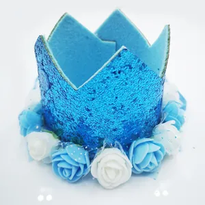 Detailed view of sparkly blue 1st birthday crown with blue and white floral trim base