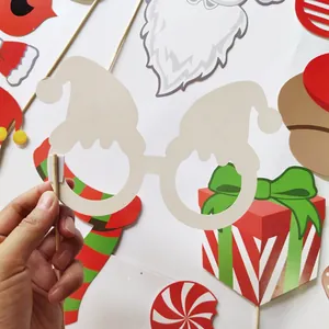 28-piece Christmas photo booth props set with Santa, reindeer and festive cards on sticks