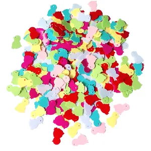 Colorful chick-shaped confetti with holes for Easter DIY crafts and party decorations