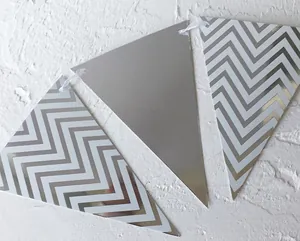 Detail showing silver wave pattern bunting flags with reflective metallic finish and texture
