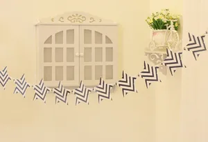 Detail of blue and white wave pattern on star-shaped party bunting for home decor