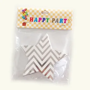 Detail of star-shaped party banner with wavy silver patterns in original packaging