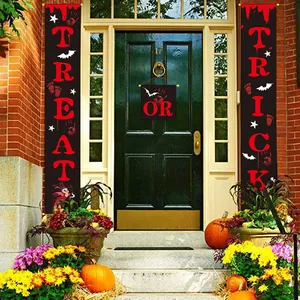 Trick or Treat Halloween banners hanging on a house front door with pumpkin decorations
