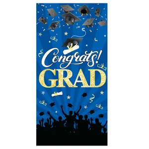 Close-up of 2024 graduation poster with gold Congrats GRAD text and falling caps