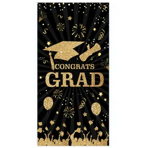 Close-up of black and gold Congrats Grad banner with fireworks and graduate silhouettes