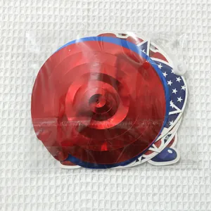 Detail of red foil swirl decorations and Fourth of July paper tags in clear packaging