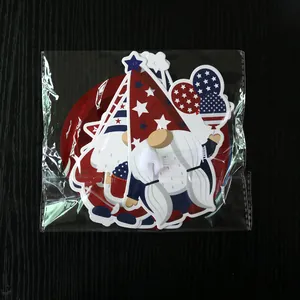 Detail of USA Independence Day gnome cardstock ornaments in clear protective plastic packaging