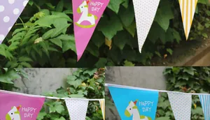 Close-up of pink and blue rocking horse bunting flags for kids birthday party decor