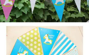 Detail of baby birthday bunting flags with rocking horse motifs and HAPPY DAY text