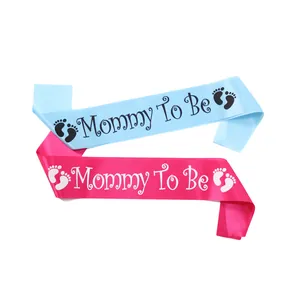 Pink and blue satin Mommy To Be sashes with baby footprints for baby shower party decorations