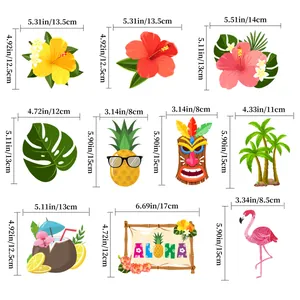 Tropical Hawaiian party decorations featuring pineapple, flamingo and monstera leaf charms
