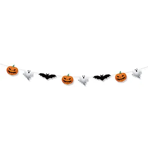Detail of Halloween paper banner featuring orange pumpkins, white ghosts and black bats