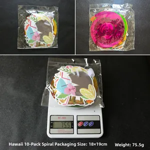 Detailed view of Hawaiian party swirl decorations featuring tropical patterns and weight scale