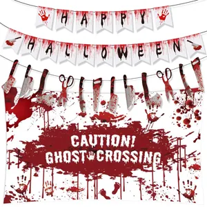 Detail of Halloween bloody weapon garland and Caution Ghost Crossing party backdrop