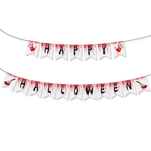 Macro detail of Halloween banner set featuring bloody handprints and splattered cleaver design