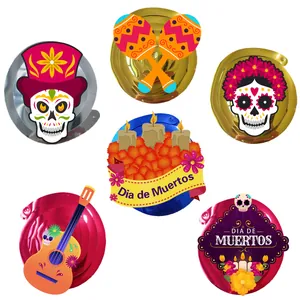 Detail of Day of the Dead hanging swirls featuring guitar, skull and maracas decorations