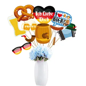11-piece Oktoberfest party photo booth props with beer mugs and pretzels on white background