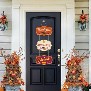 Three-tier wooden Thanksgiving door sign with Thankgive Grateful Blessed on black door