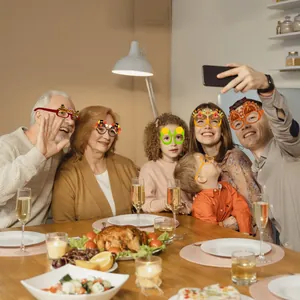 Funny Thanksgiving party paper glasses set featuring turkey and maple leaf designs