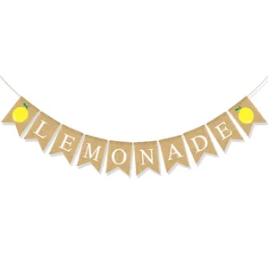 Detail of burlap banner with white LEMONADE lettering and yellow lemon prints
