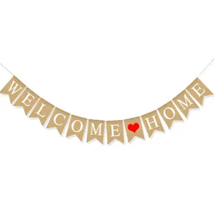 Close-up of rustic burlap banner with white Welcome Home letters and a red heart