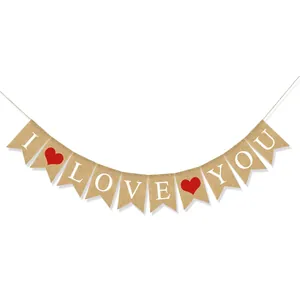 Close-up of burlap swallowtail banners with I LOVE YOU text and red heart designs