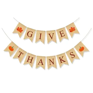 Detail of Give Thanks burlap banner with maple leaf and pumpkin motifs for Thanksgiving decor