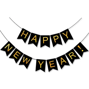 Detail of Happy New Year banner with gold foil letters on black swallowtail flags