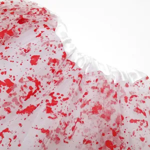 Detailed macro shot of white mesh tutu texture with realistic red blood splatter patterns
