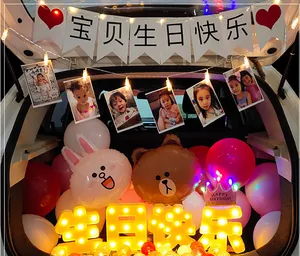 Car trunk birthday surprise setup with LED lights and cartoon character balloons