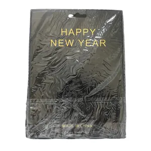 Black and gold Happy New Year banner in festive packaging for 2024 party decor